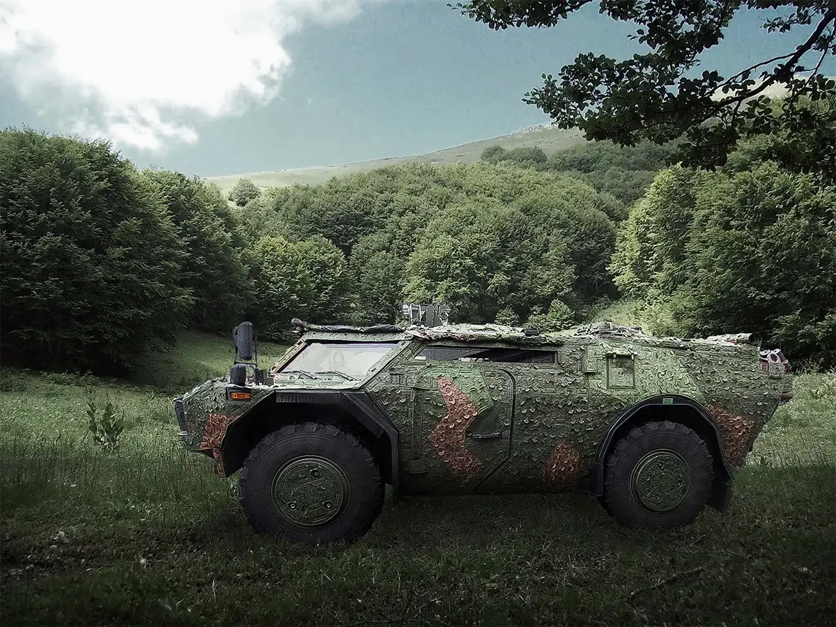 Saab Barracuda Mobile Camouflage System on Fennek vehicle in woodland